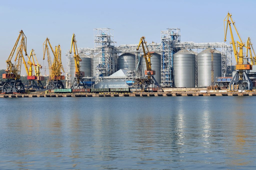 Industrial zone of Odessa sea port. Port harbor with grain elevator terminal and container area.